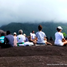 Robin, Nature Seychelles' Green Yoga instructor leading a listening meditation